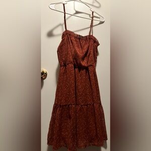 Sundress with flowers, never worn, brand new, between like rust or maroon color